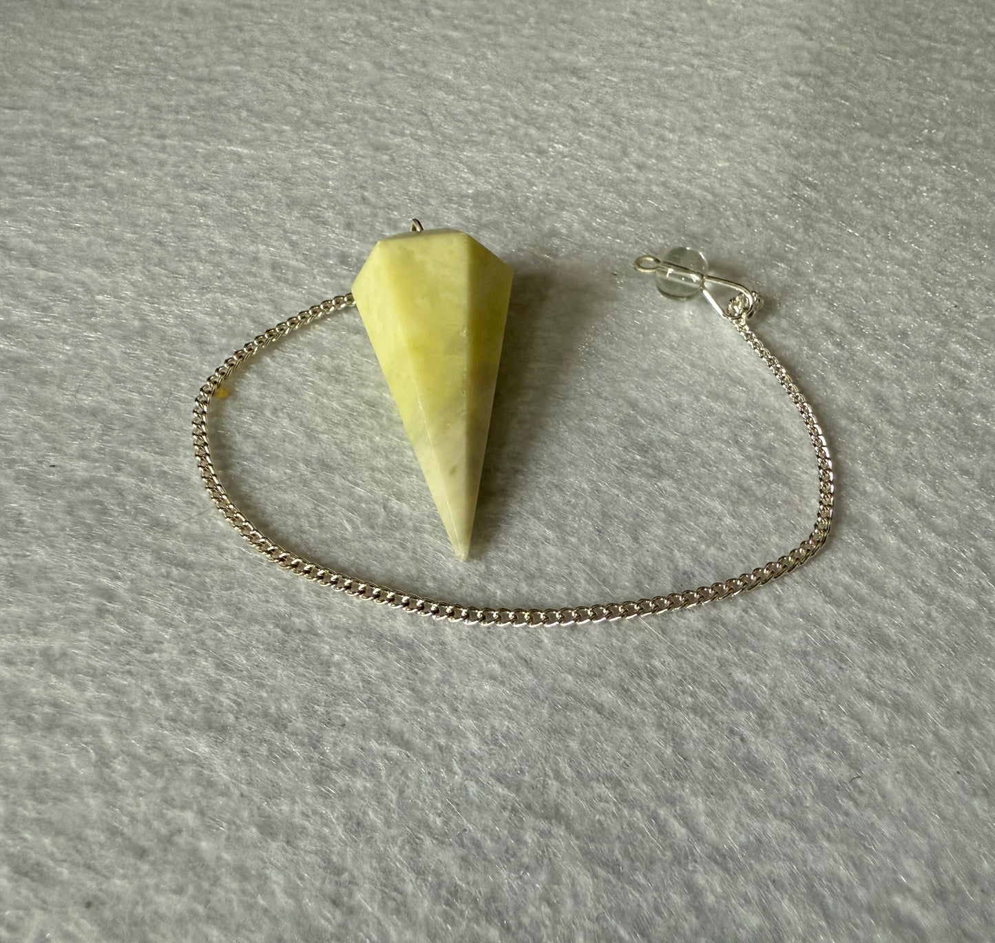 Beautiful Serpentine Pendulum is  1.5” and with chain is 8.75”