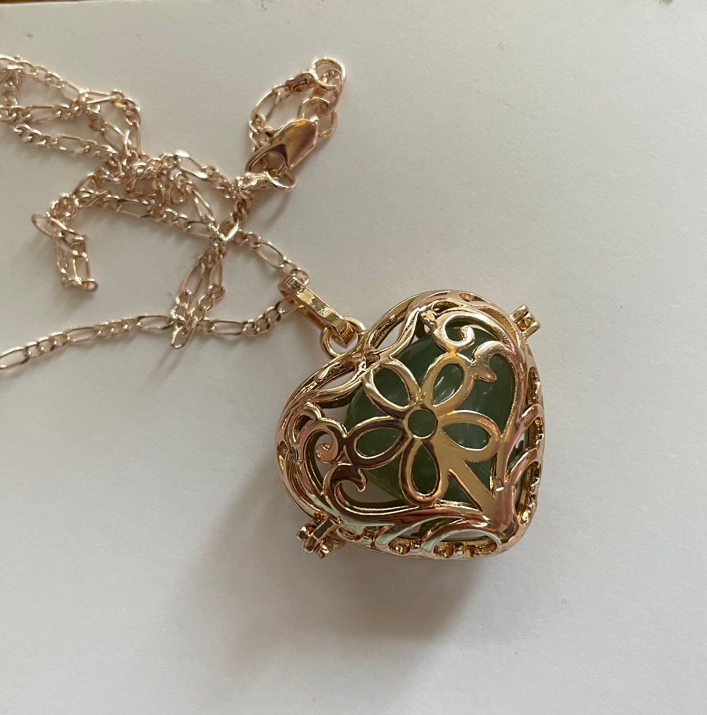 Gold locket filled with 6 interchangeable crystals on 18” rose gold chain