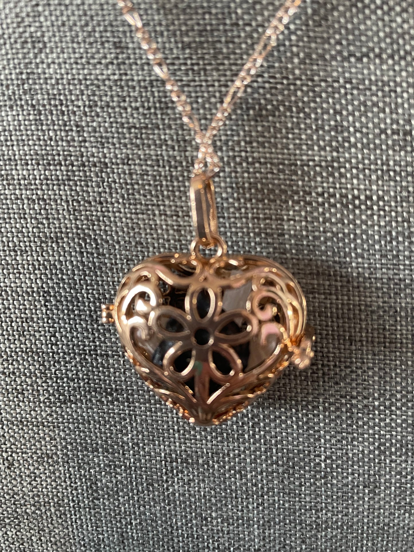 Gold locket filled with 6 interchangeable crystals on 18” rose gold chain