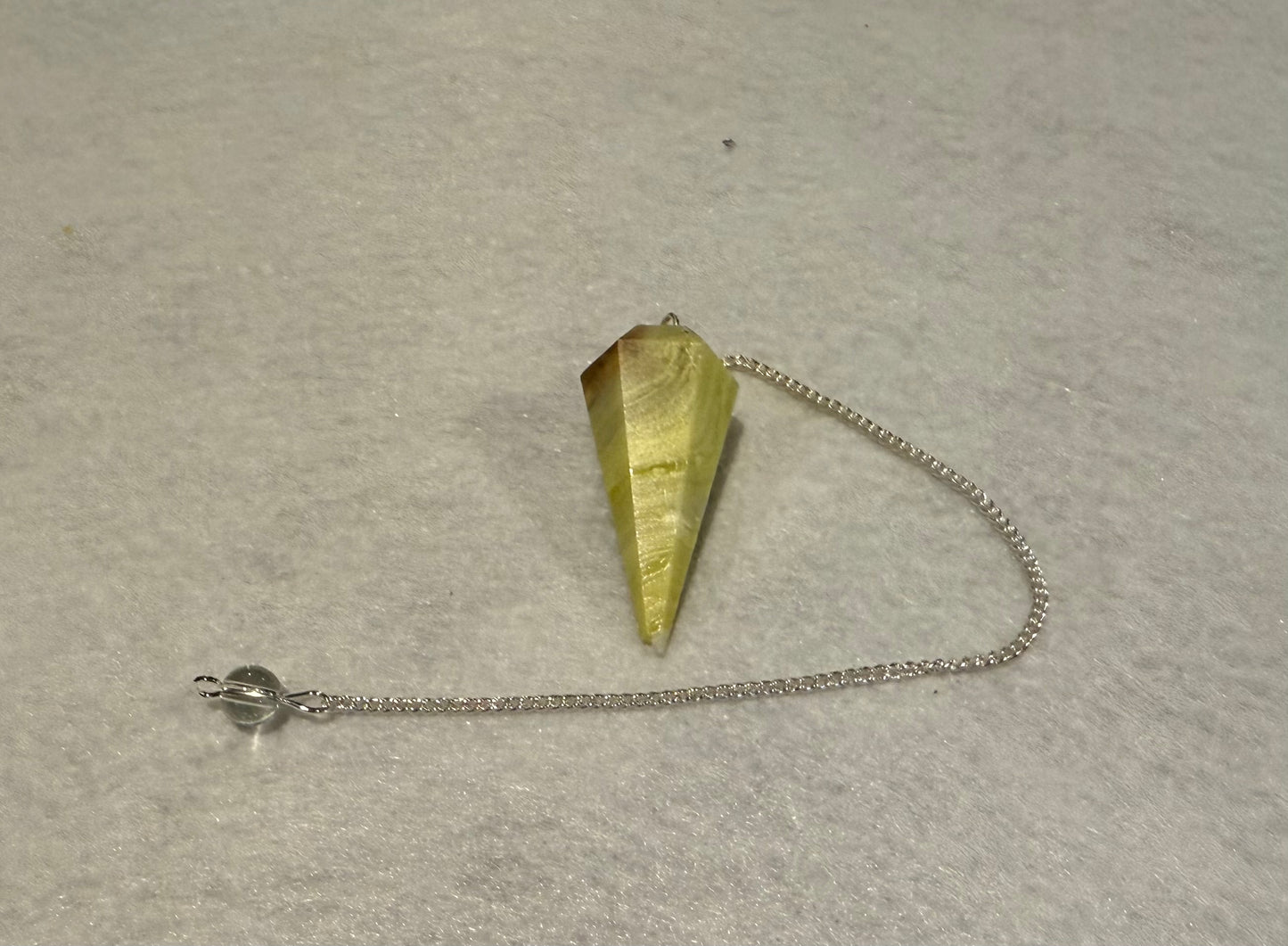 Beautiful Serpentine Pendulum is  1.5” and with chain is 8”.