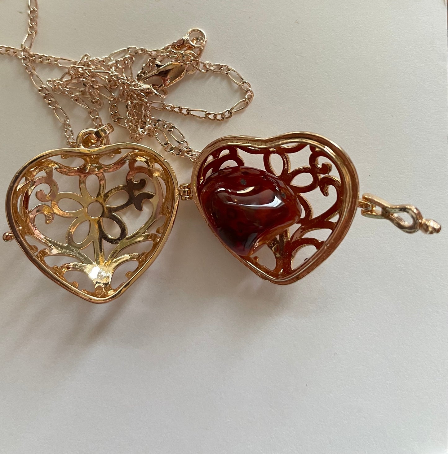 Gold locket filled with 6 interchangeable crystals on 18” rose gold chain