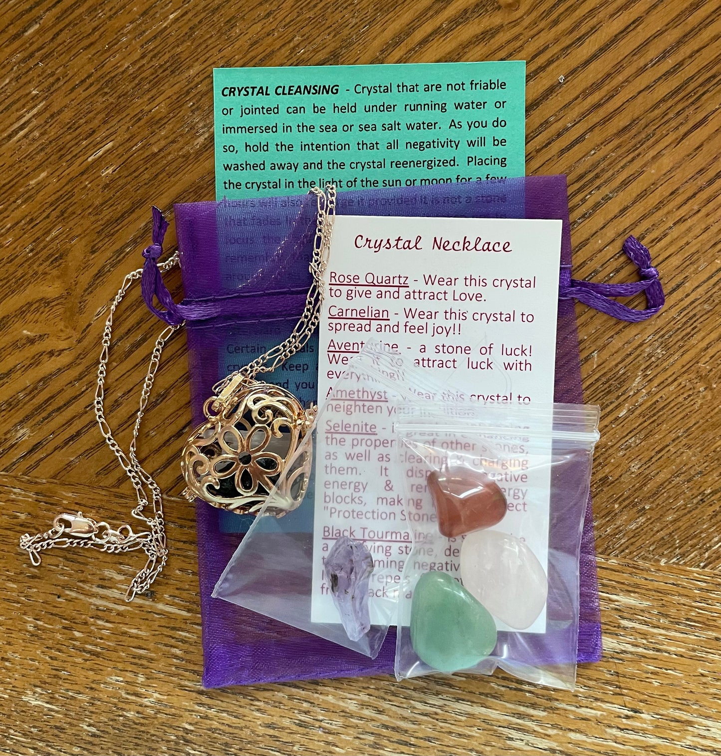 Gold locket filled with 6 interchangeable crystals on 18” rose gold chain