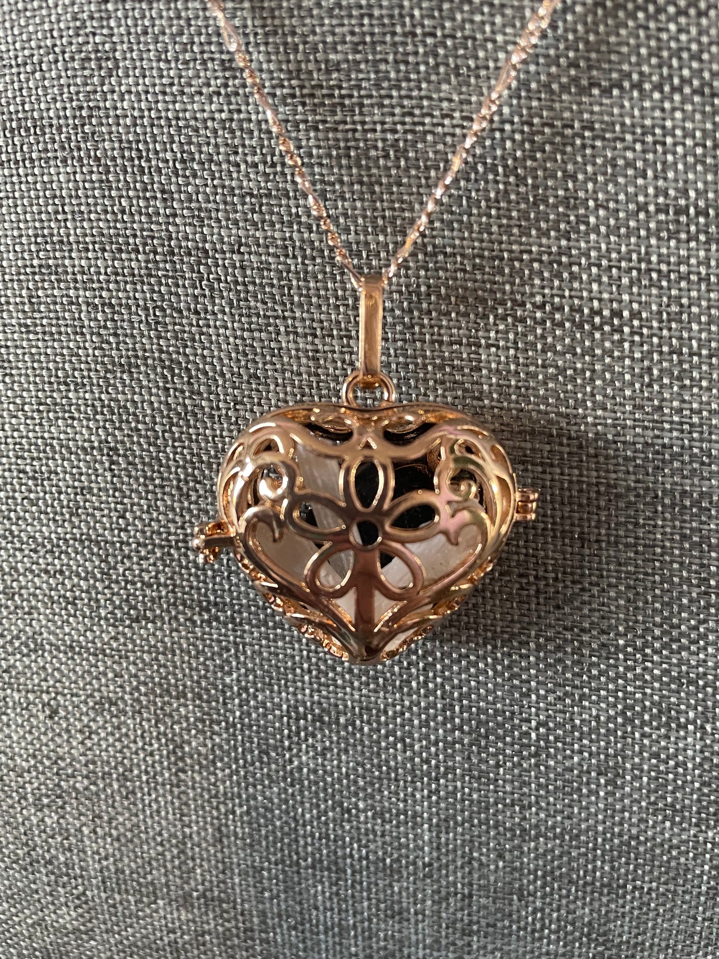 Gold locket filled with 6 interchangeable crystals on 18” rose gold chain