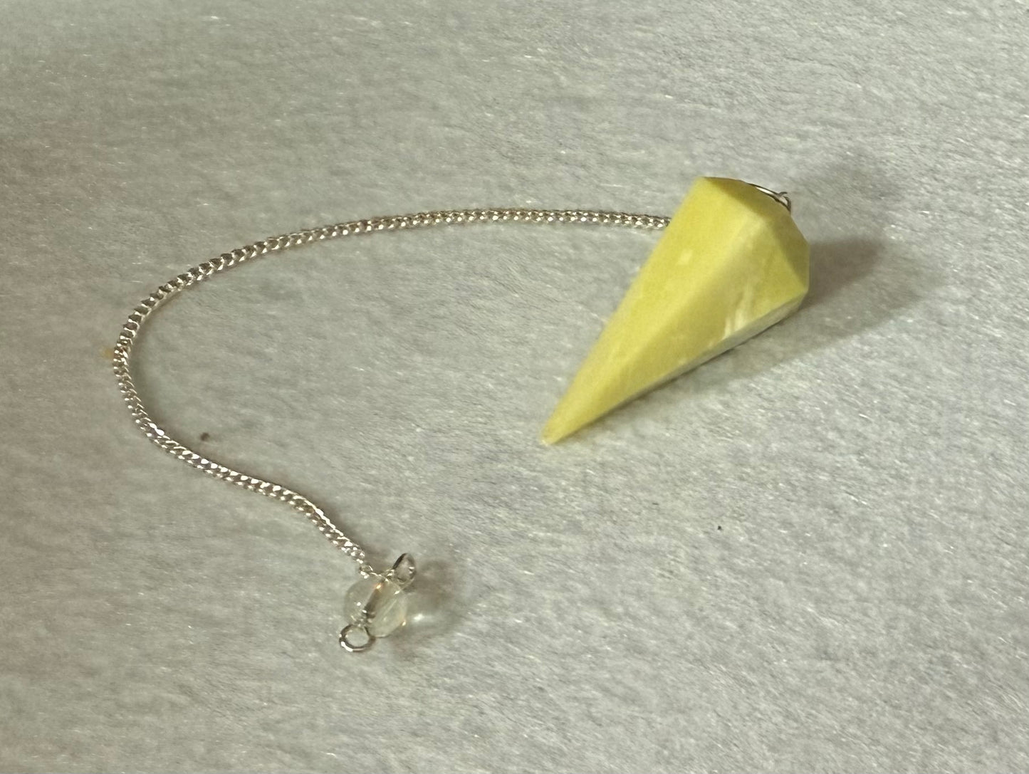 Beautiful Serpentine Pendulum is  1.5” and with chain is 8.5”