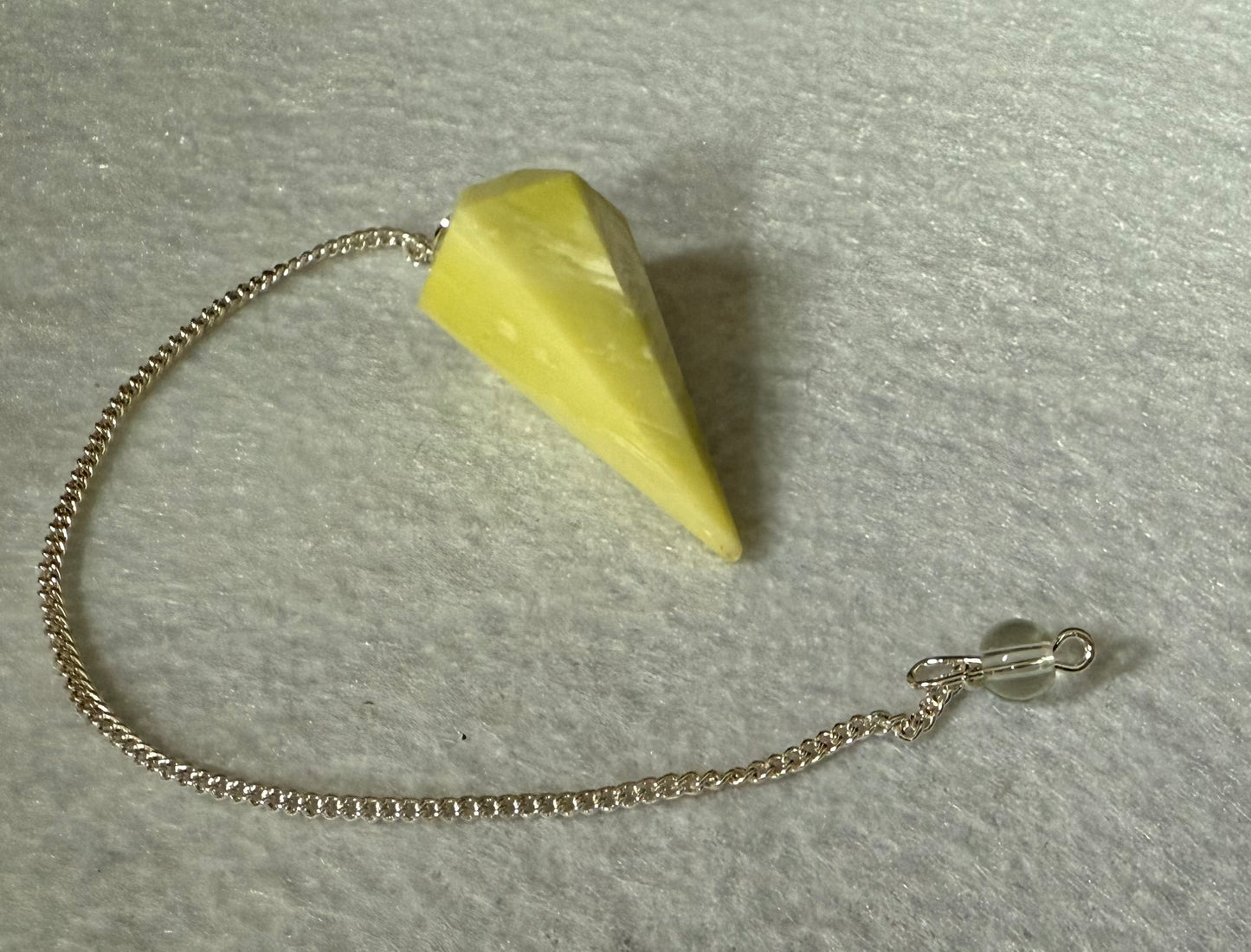 Beautiful Serpentine Pendulum is  1.5” and with chain is 8.5”