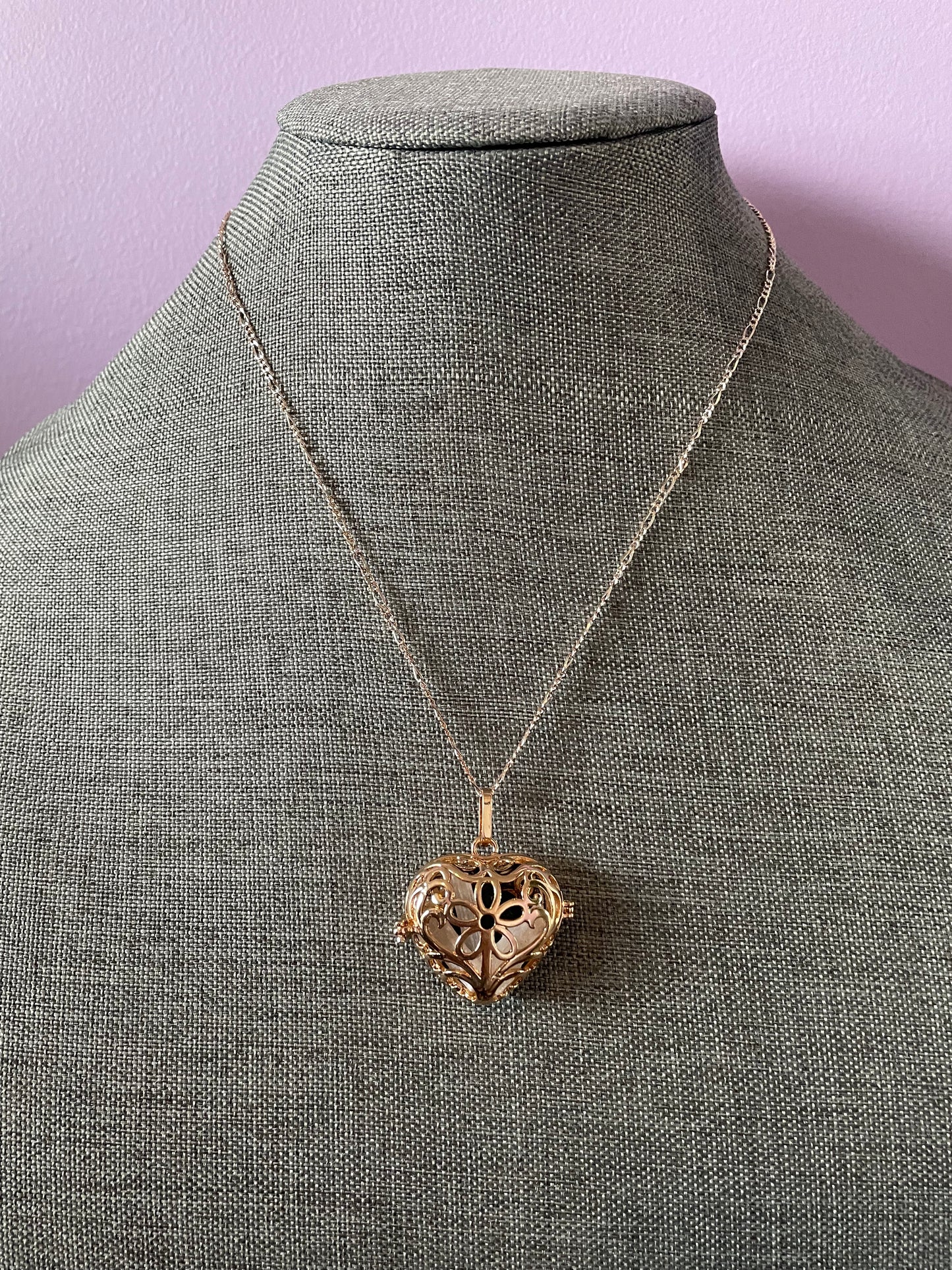 Gold locket filled with 6 interchangeable crystals on 18” rose gold chain