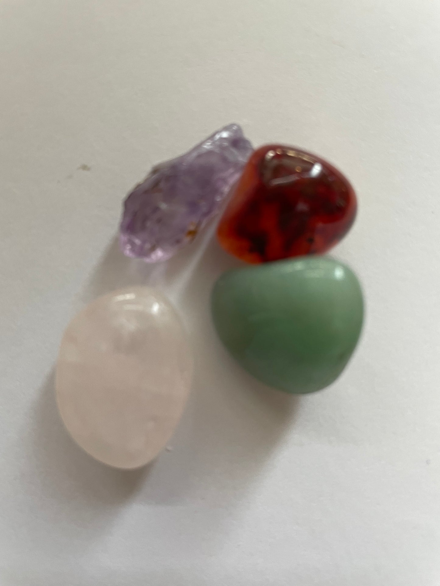 Gold locket filled with 6 interchangeable crystals on 18” rose gold chain