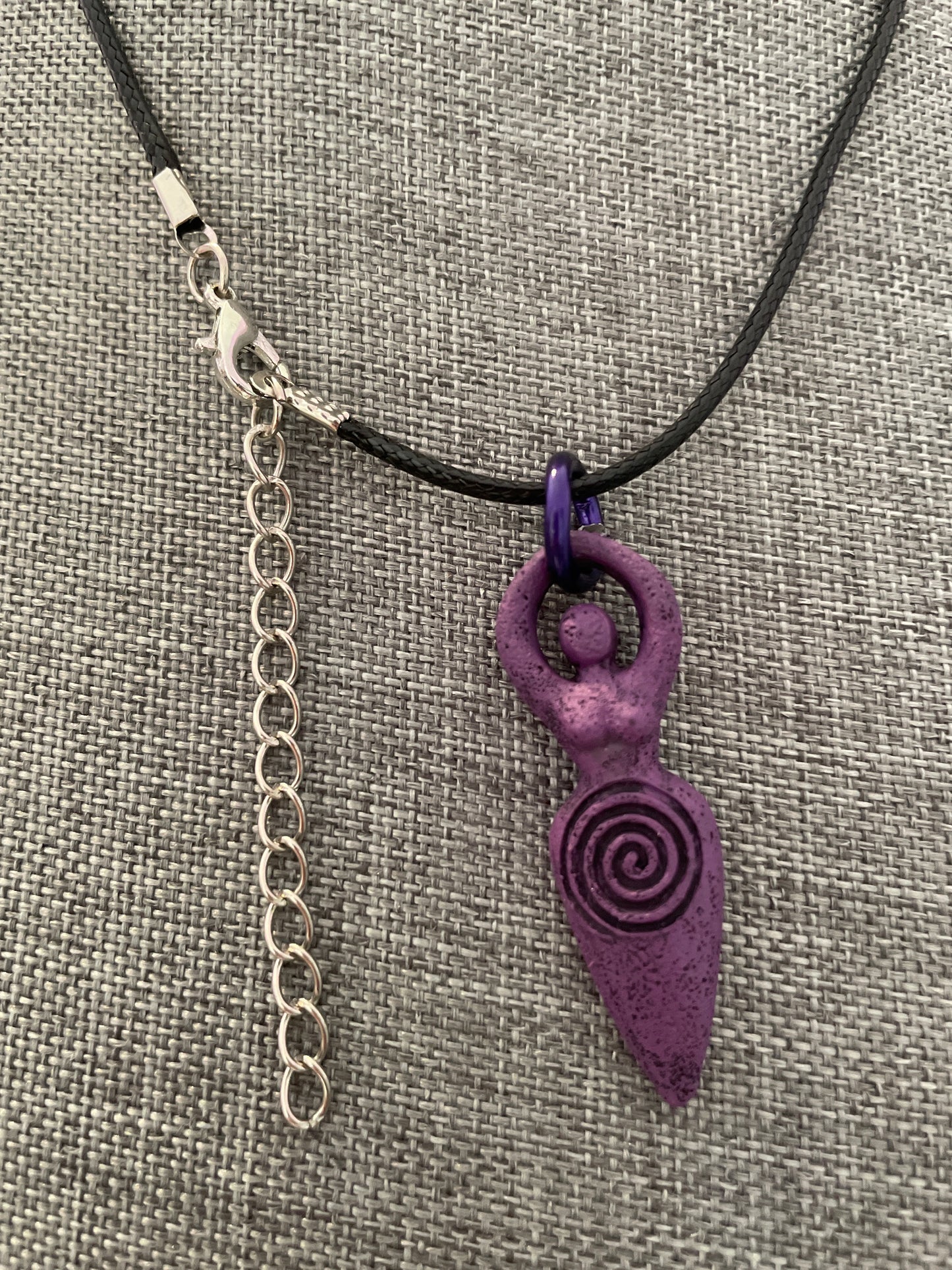 The Goddess pendant necklace on black cord.