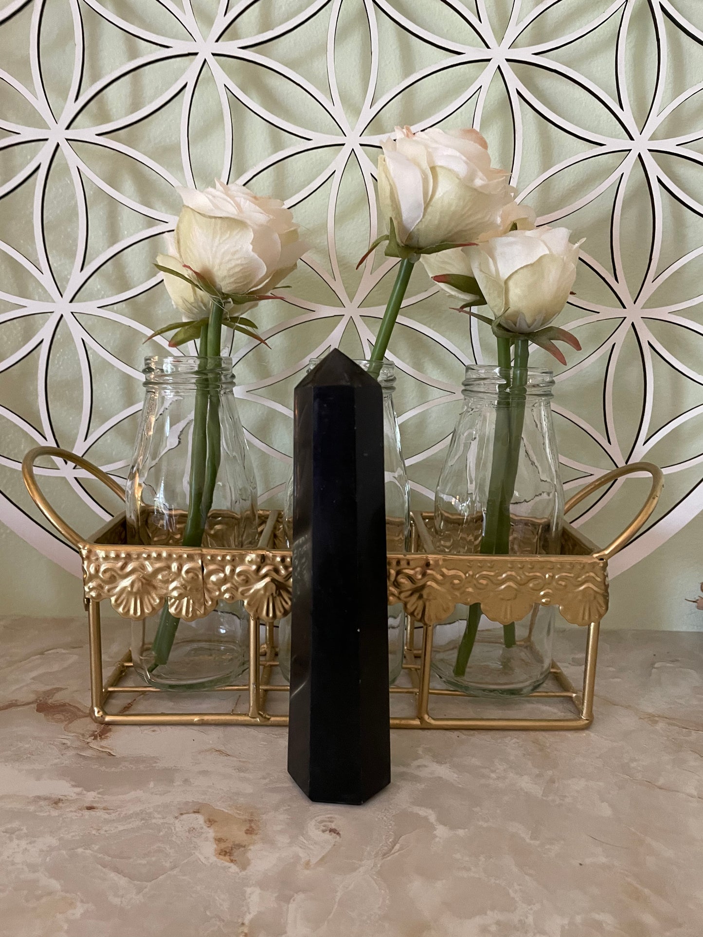 This magnificent Black Tourmaline point is approximately 6” tall and weighs 8.7 ounces.