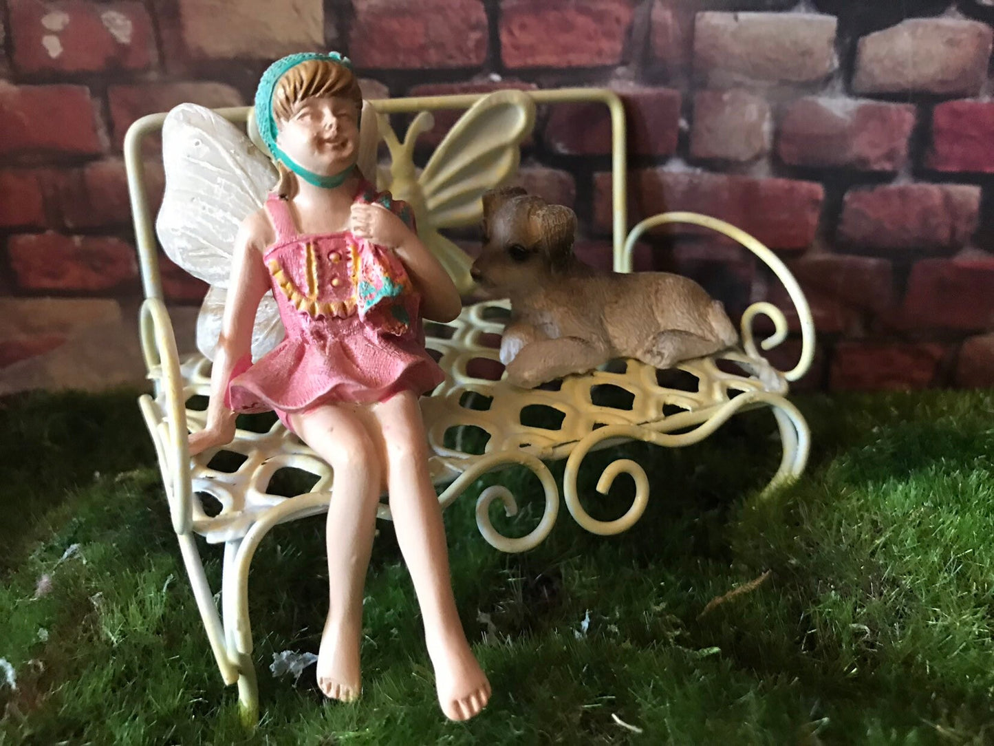 Sweet fairy figurine sitting in swimming suit and ready for summer