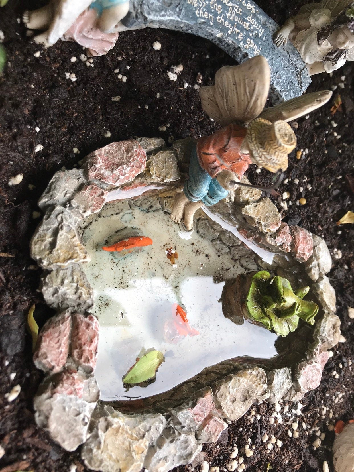 Fairy boy figurine with fishing pole