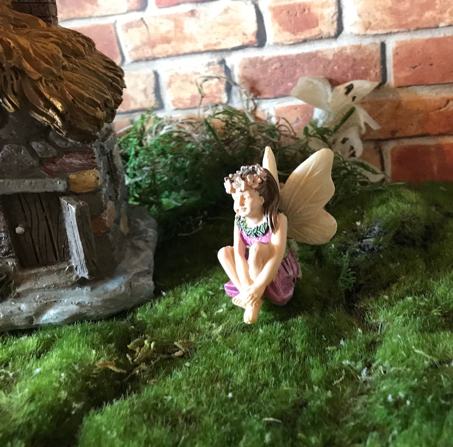 Sweet fairy girl sitting restfully looking so delicate