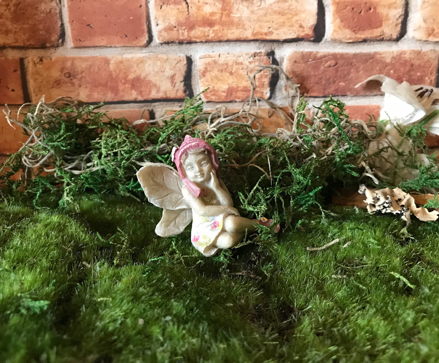 Sweet fairy girl sitting restfully