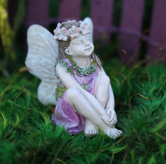 Sweet fairy girl sitting restfully looking so delicate