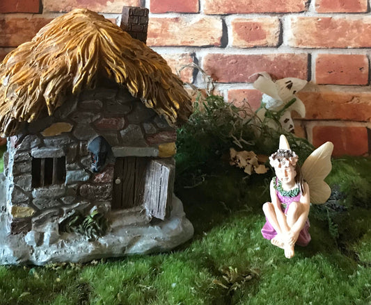 Sweet fairy girl sitting restfully looking so delicate