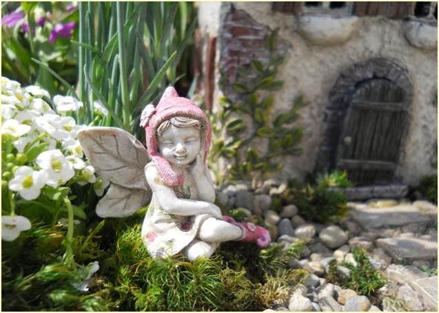 Sweet fairy girl sitting restfully