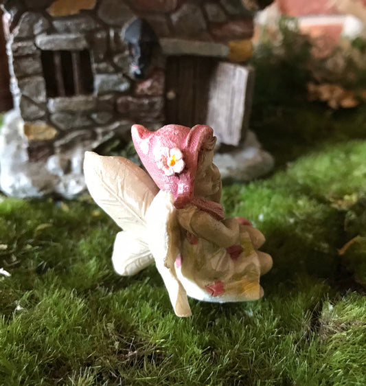 Sweet fairy girl sitting restfully