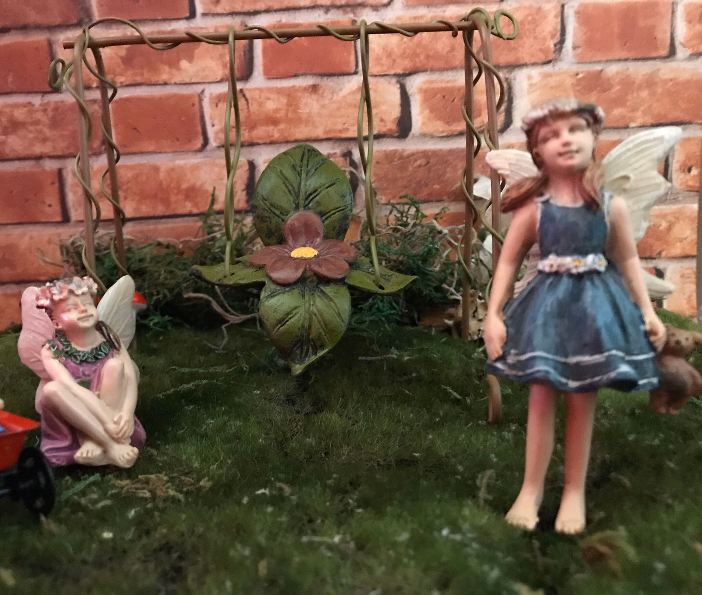 Sweet fairy girl with teddy bear toy