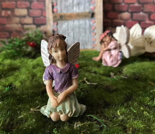 Fairy girl wearing a purple shirt and green skirt