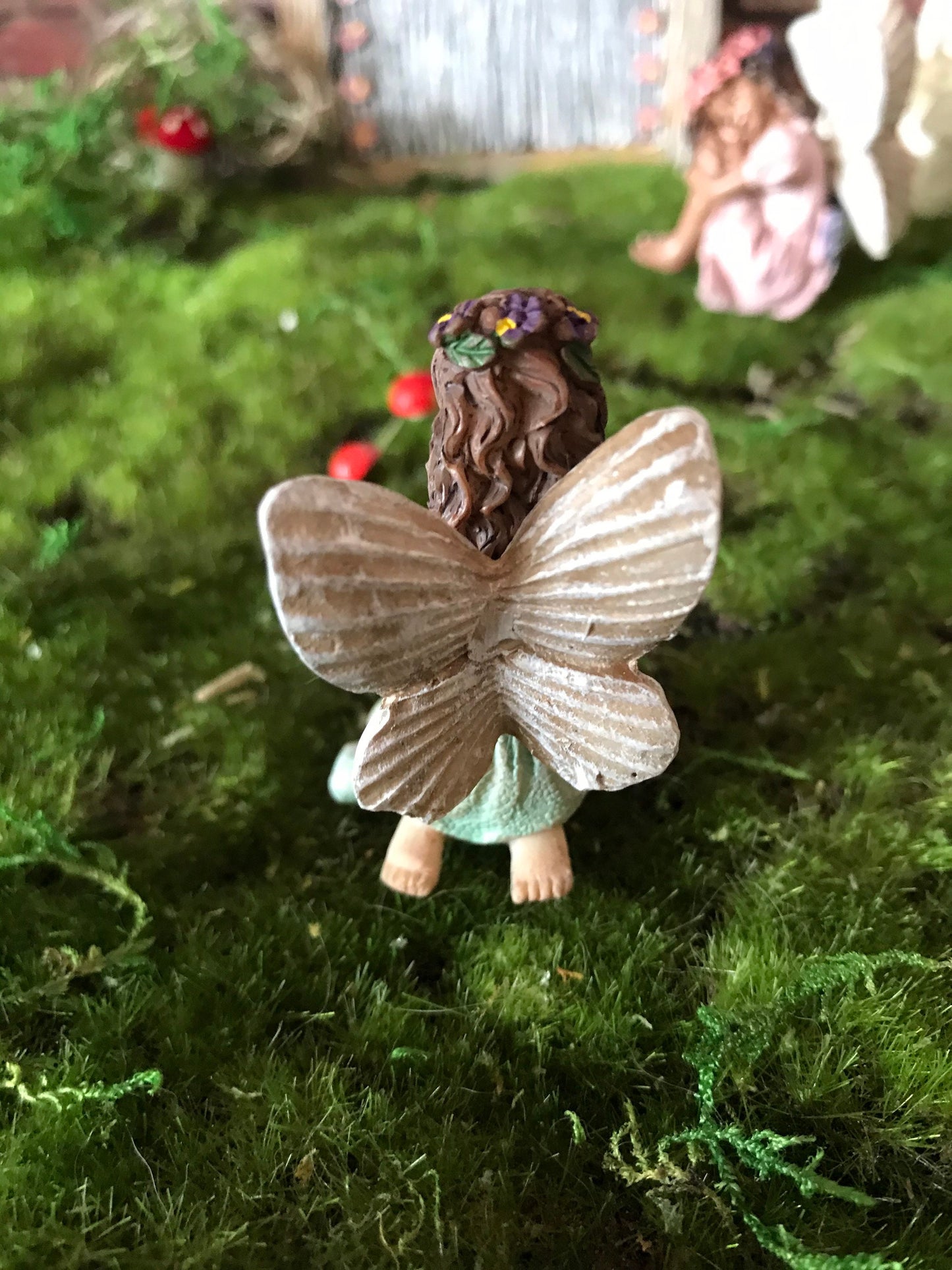 Fairy girl wearing a purple shirt and green skirt