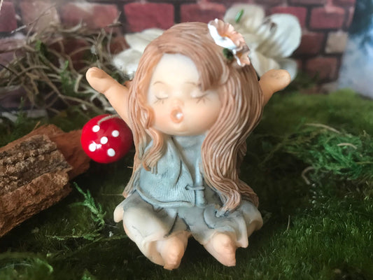 Sweet, yawning, miniature fairy with pretty brown hair fairy