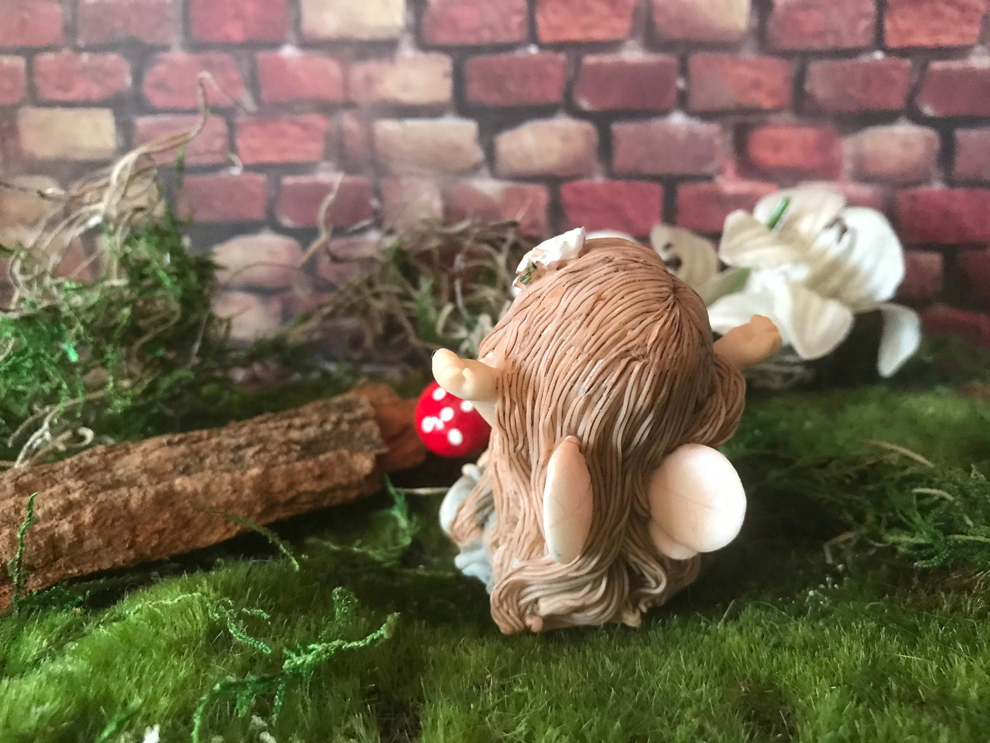 Sweet, yawning, miniature fairy with pretty brown hair fairy
