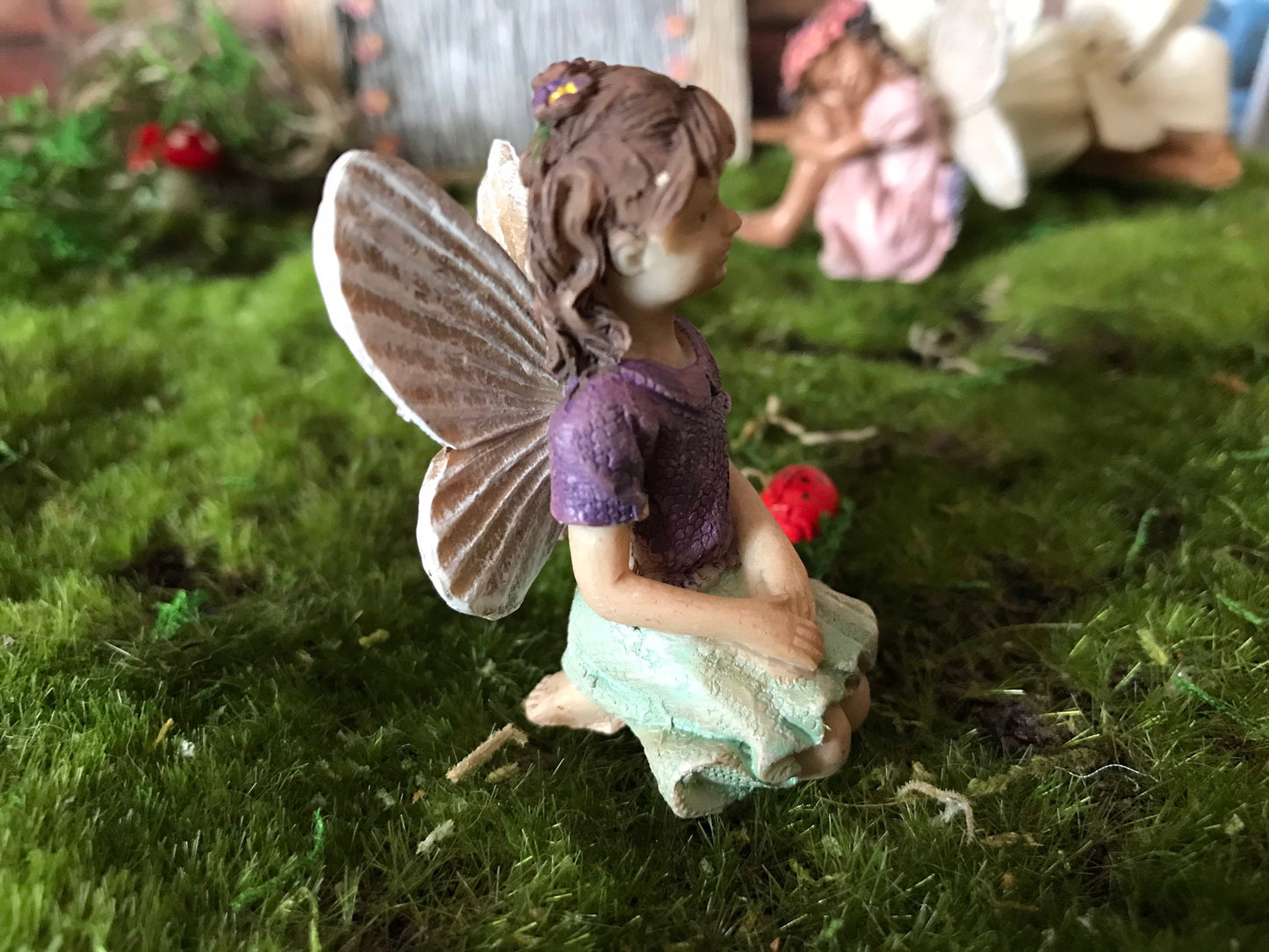 Fairy girl wearing a purple shirt and green skirt