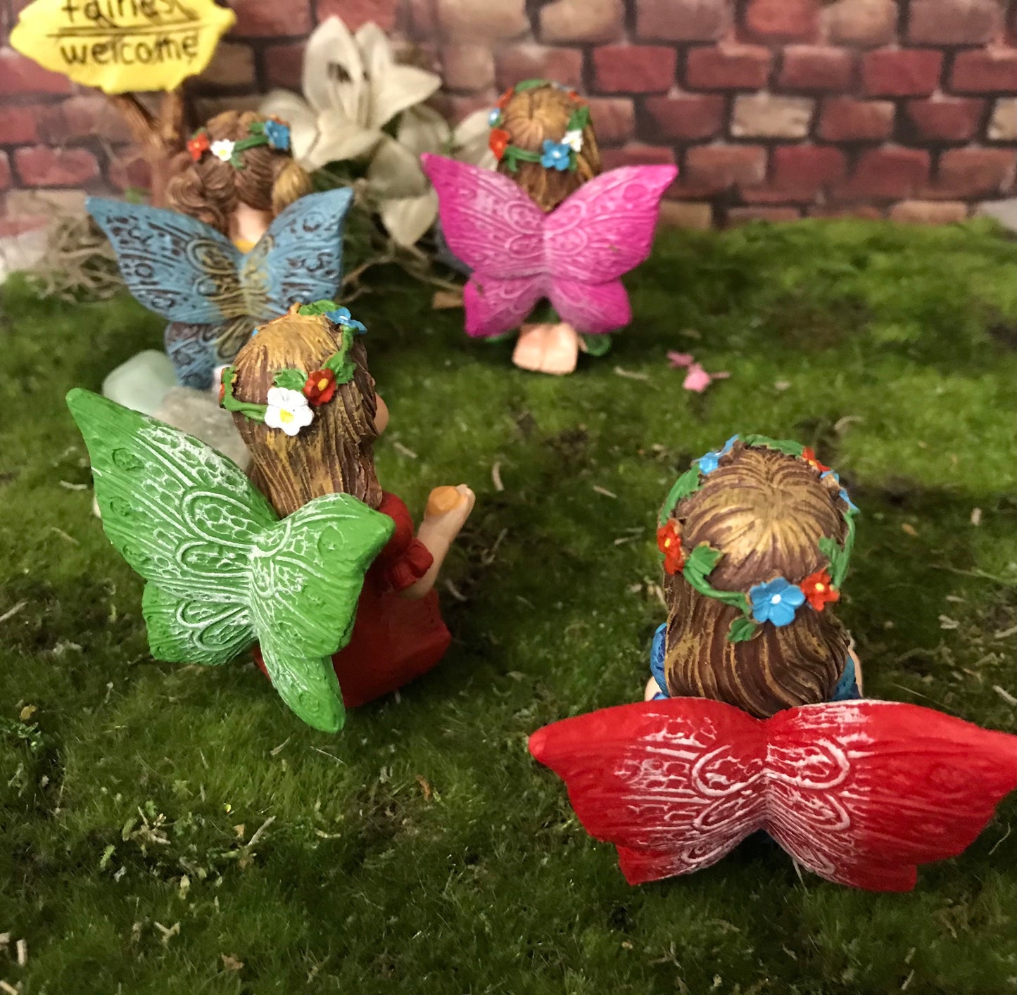Just look at these sweet faces! Set of 4 miniature fairy garden fairy holding a cute gem