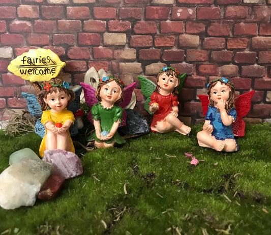 Just look at these sweet faces! Set of 4 miniature fairy garden fairy holding a cute gem
