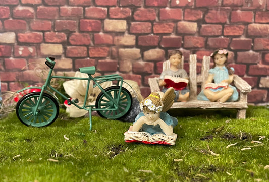 Sweet youthful girl fairy is leisurely reading a pleasant book Just Be Happy