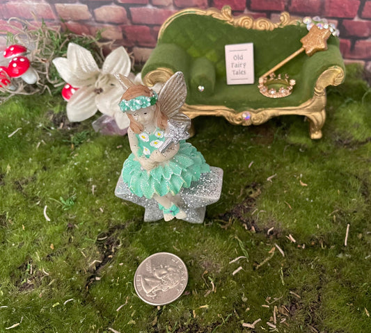 Sweet magical fairy girl sitting on a glittery star!