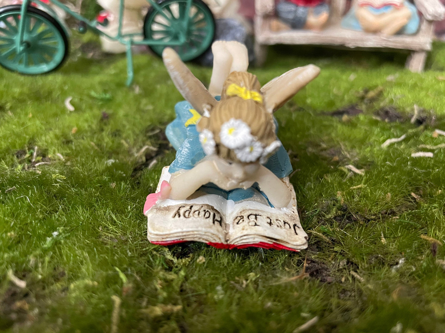 Sweet youthful girl fairy is leisurely reading a pleasant book Just Be Happy