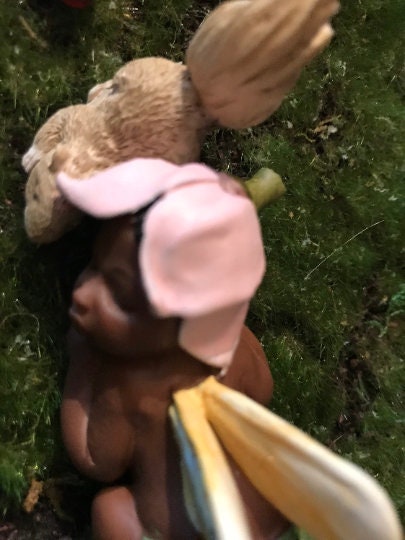 Precious baby fairy is sleeping peacefully while resting her sweet head on her precious squirrel friend.