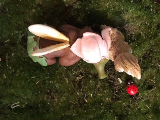 Precious baby fairy is sleeping peacefully while resting her sweet head on her precious squirrel friend.