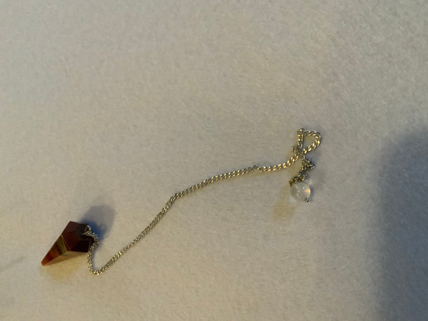 This beautiful Carnelian Pendulum is  1.25” with chain 9”