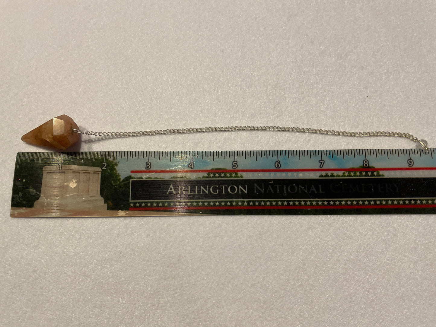 Beautiful Carnelian Pendulum is 1.25” and with the chain it is approximately 9.5”