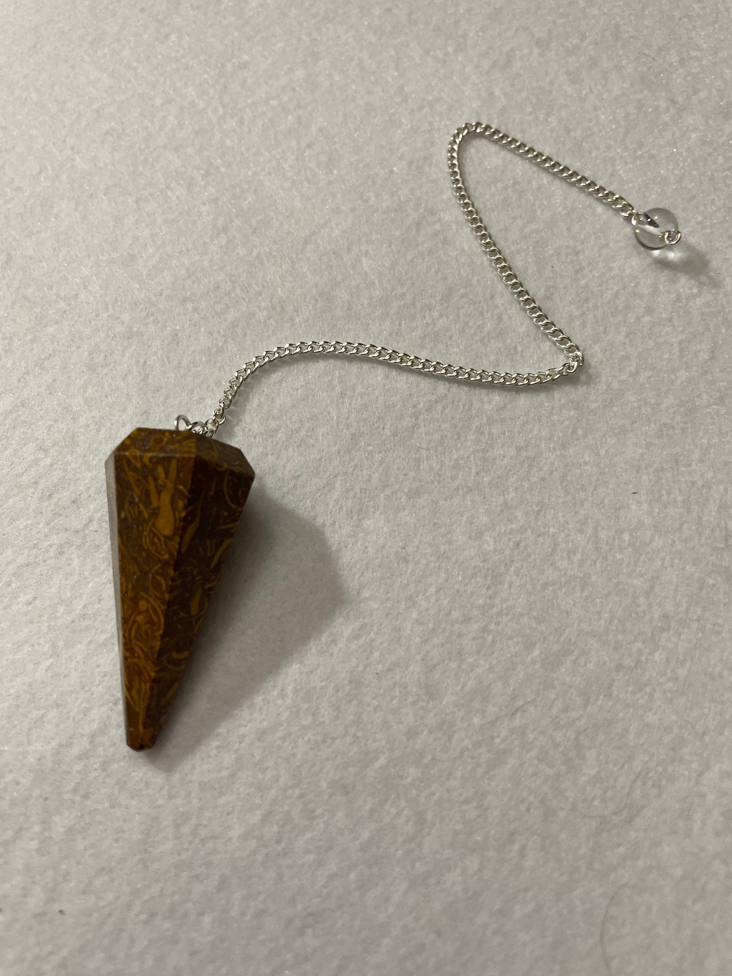 This Mariam Jasper Pendulum is 1.50” and with the chain is 8.25”.