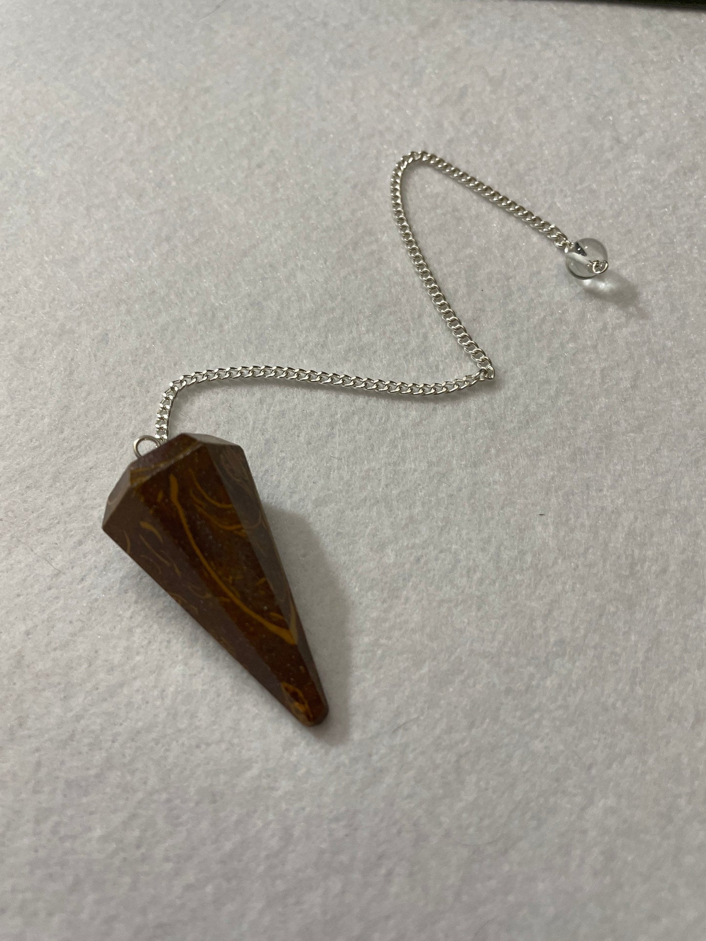 This Mariam Jasper Pendulum is 1.50” and with the chain is 8.25”.