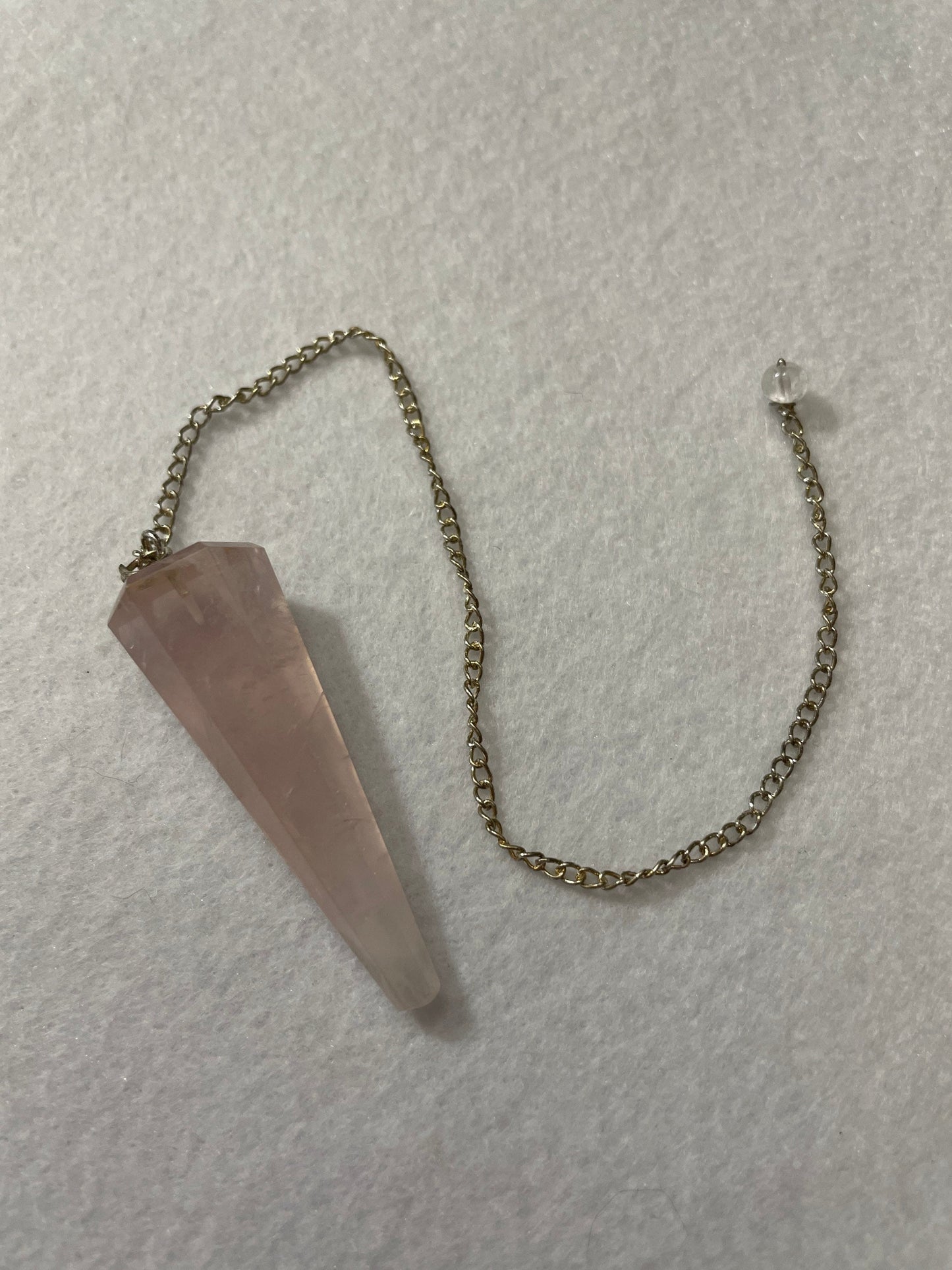 This beautiful Rose Quartz Pendulum is 1.75” and with chain is 8.75”