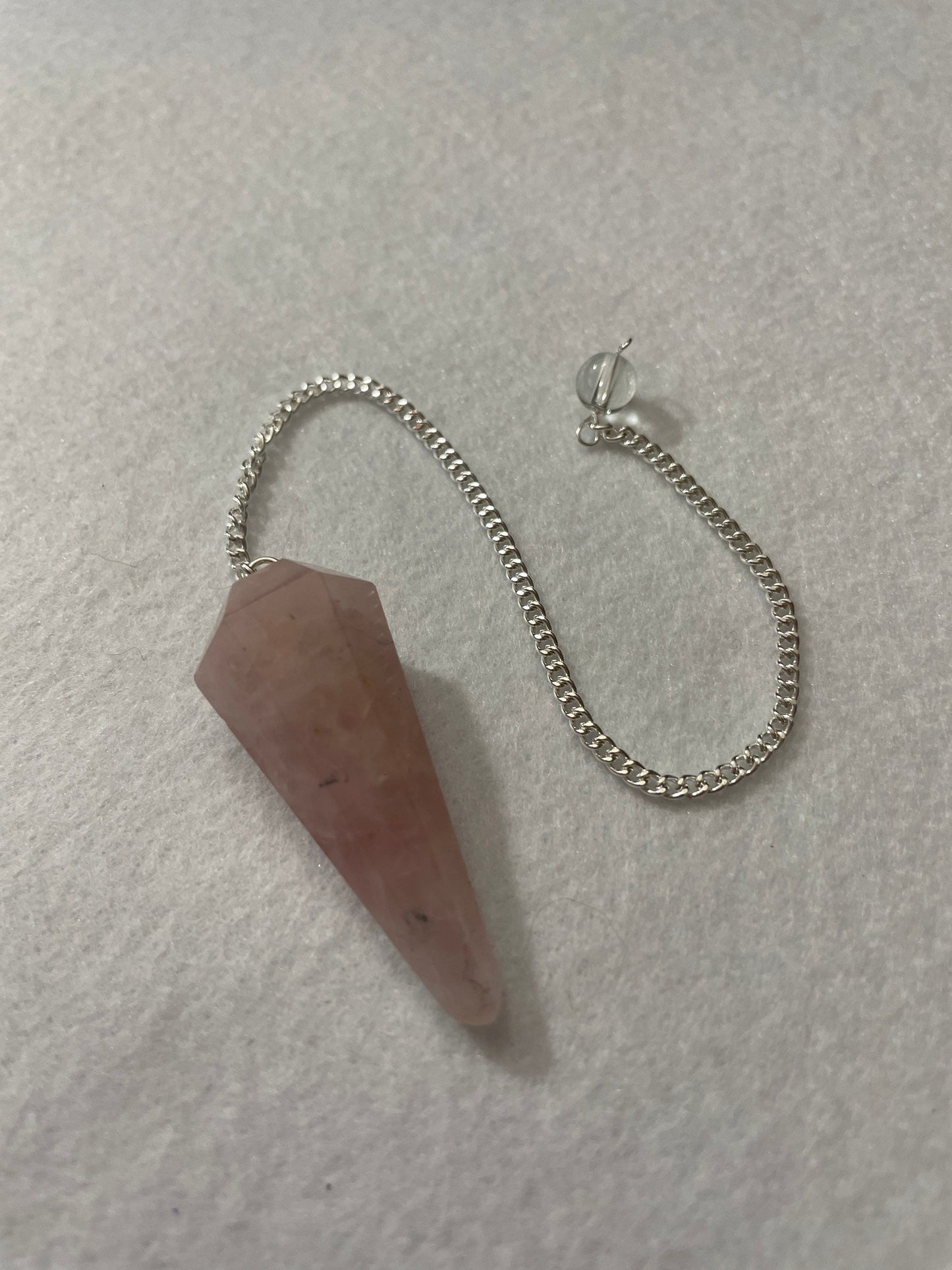 This beautiful Rose Quartz Pendulum is 1.65” and with chain is 8.5”