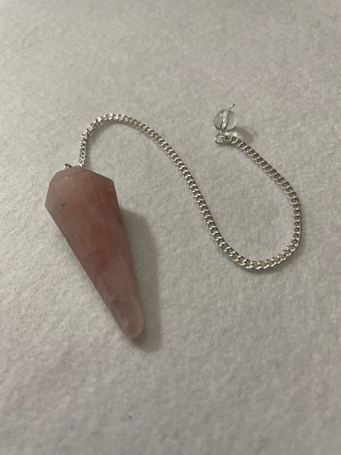 This beautiful Rose Quartz Pendulum is 1.65” and with chain is 8.5”