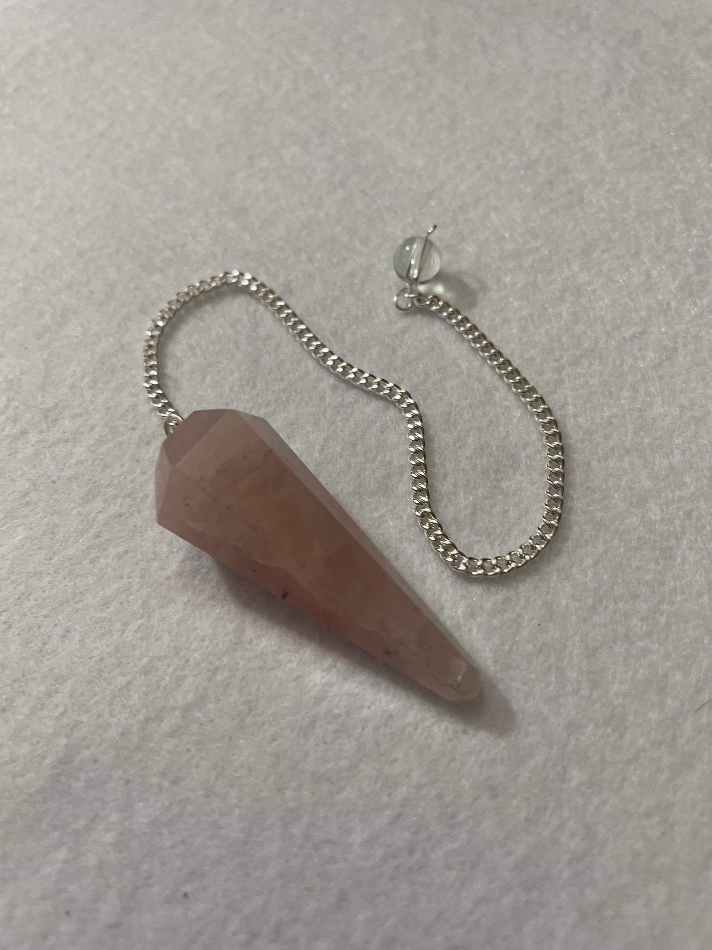 This beautiful Rose Quartz Pendulum is 1.65” and with chain is 8.5”