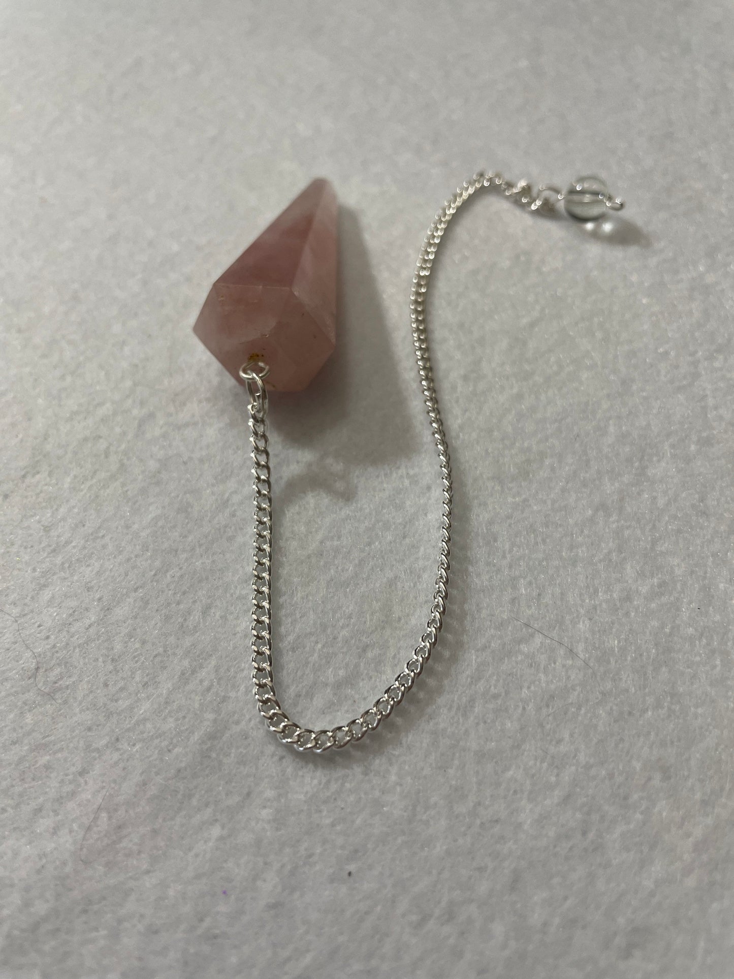 This beautiful Rose Quartz Pendulum is 1.65” and with chain is 8.5”