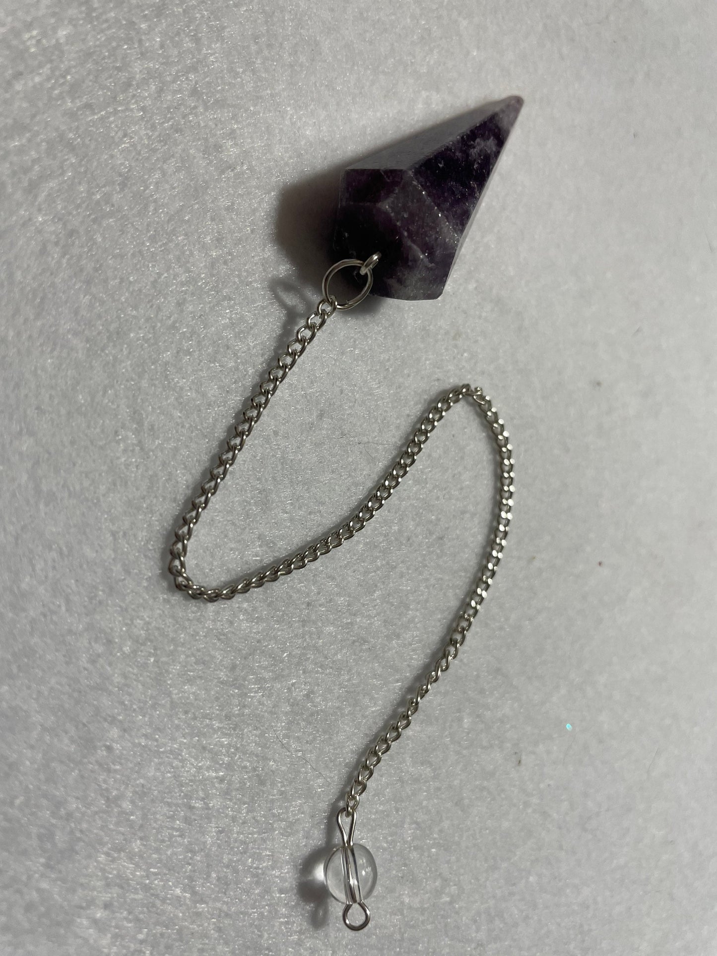 This beautiful Amethyst Pendulum is 1.50” and with chain is 8.5”