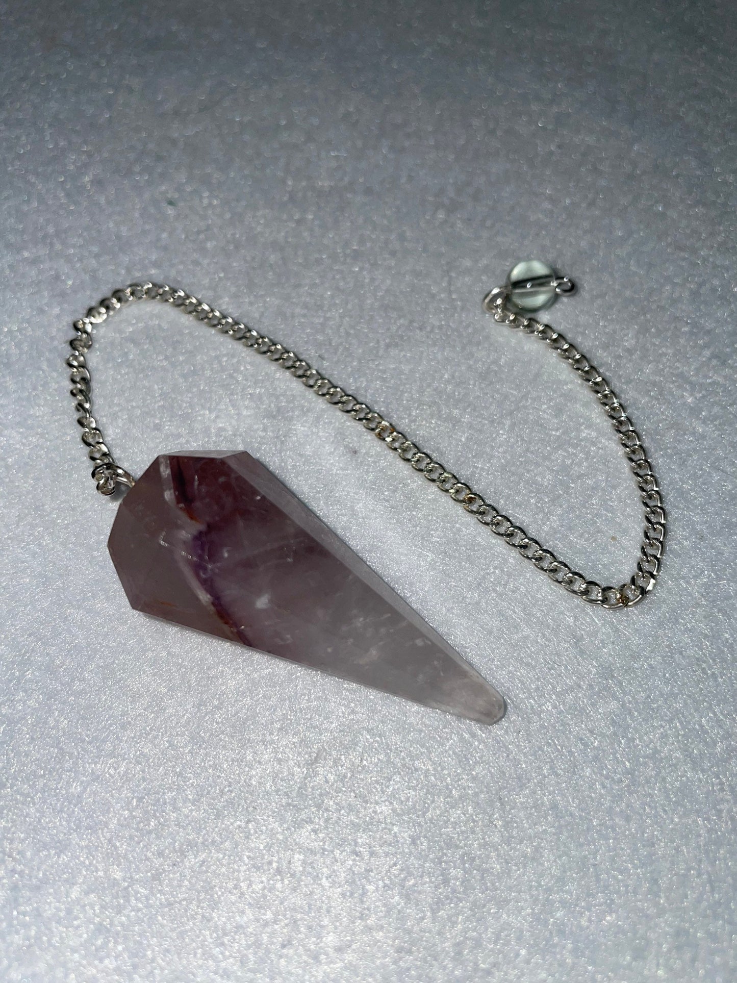 Amethyst Pendulum is 1.75” and with chain is 8.75”