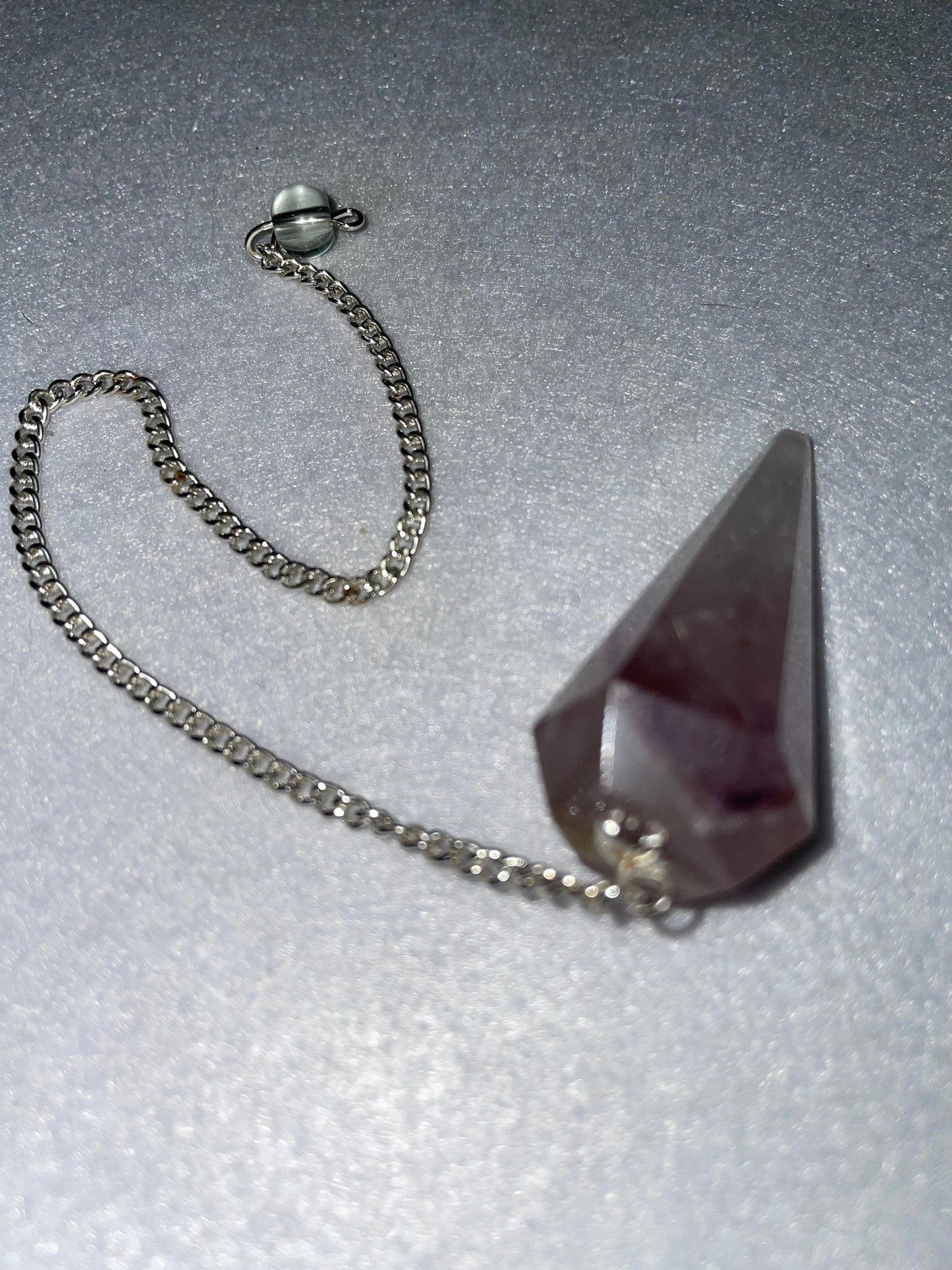 Amethyst Pendulum is 1.75” and with chain is 8.75”