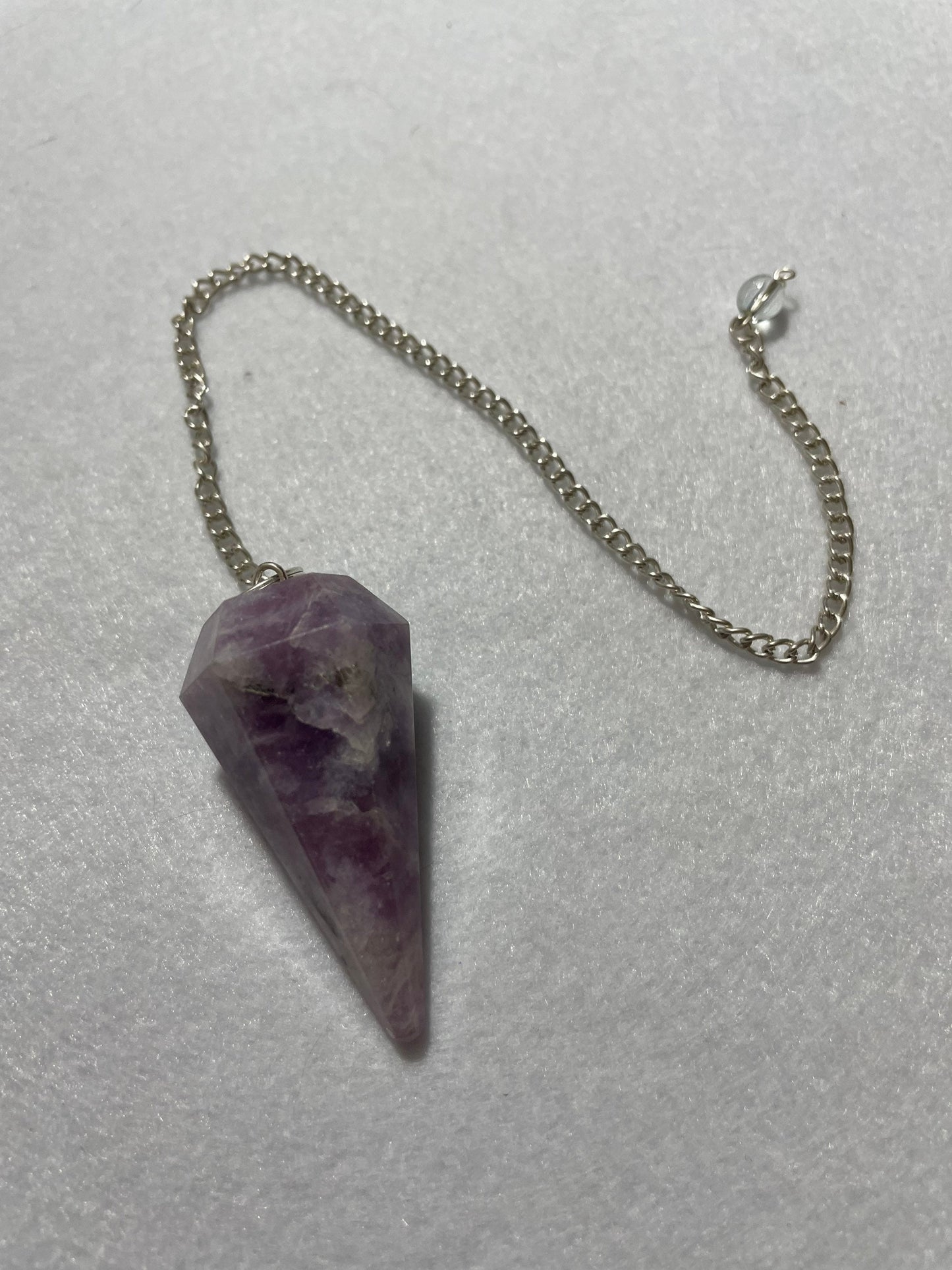 Gorgeous Lepidolite Pendulum is 1.75” and with chain is 9.25”