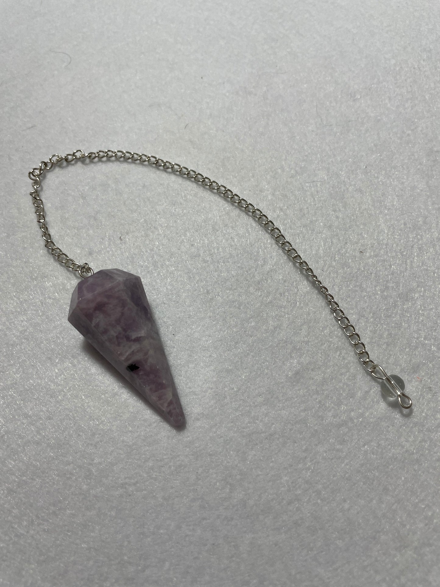 This beautiful Lepidolite Pendulum is 1.65” and with chain is 9”
