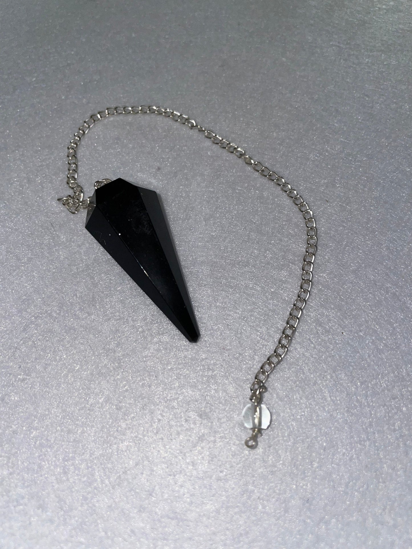 Black Obsidian Pendulum is 1.65” and with chain is 9”