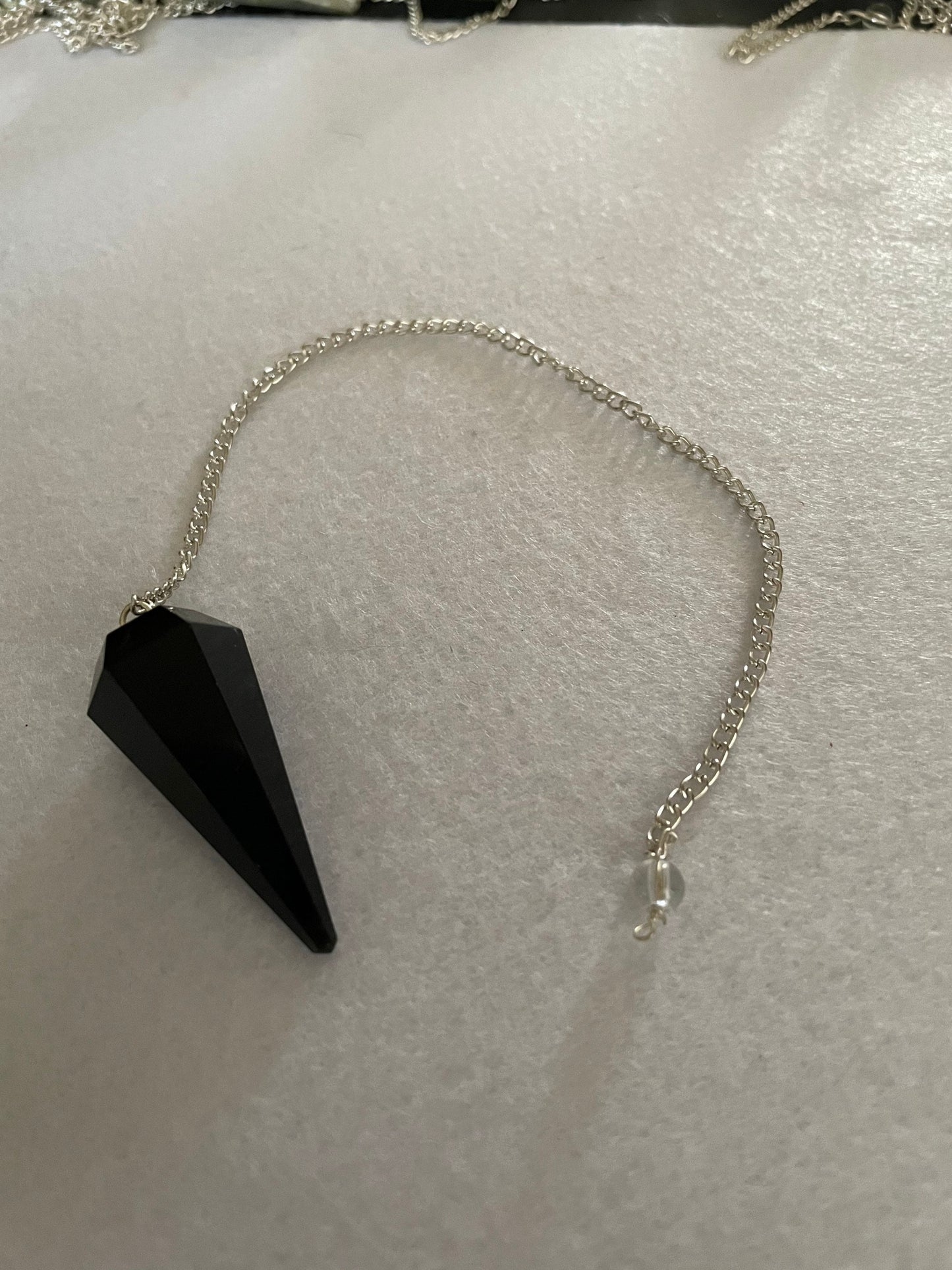 Black Obsidian Pendulum is 1.65” and with chain is 9”